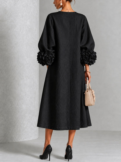 Isabea - Vestido negro con flor escultural
